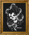 Framed artwork of a skull with barbed wire against a black background