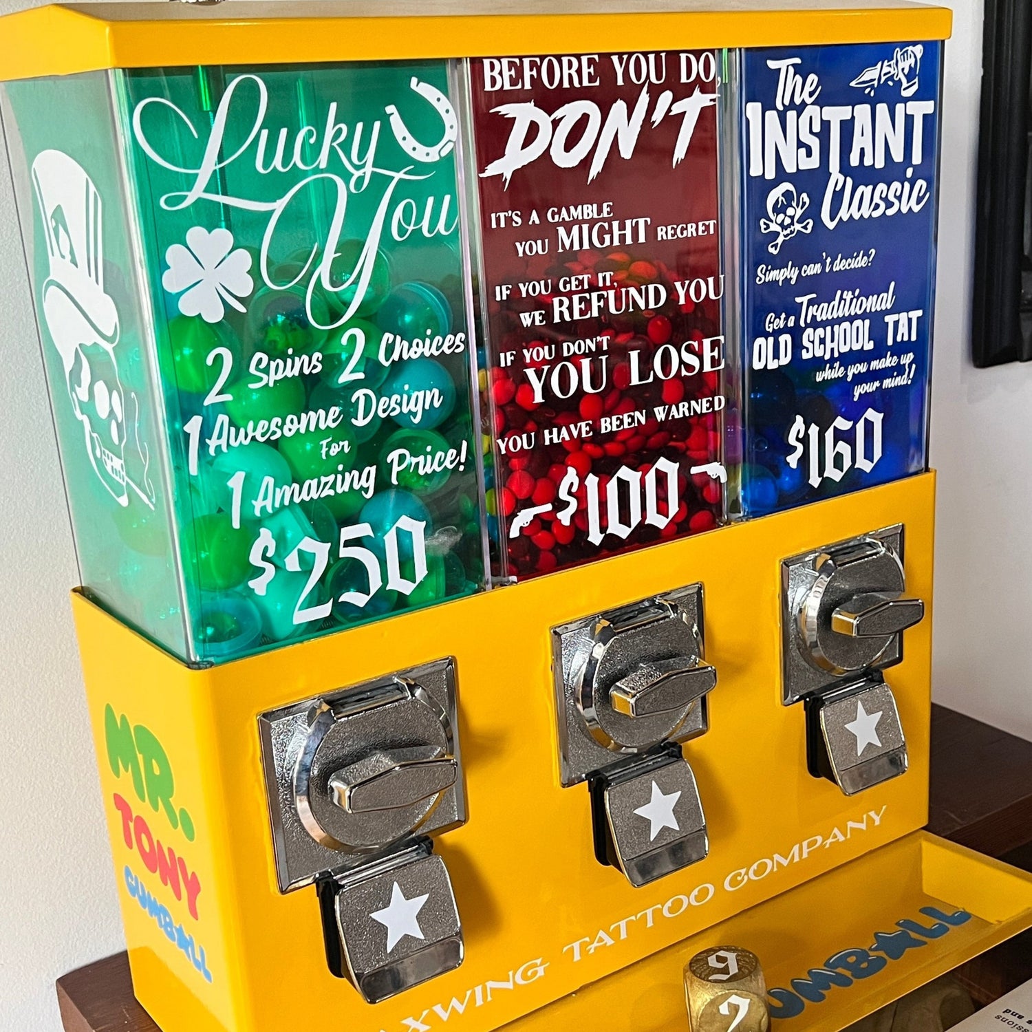 Vending machine with colorful labels on a wooden surface